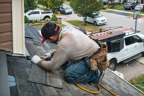 Professional Roofing technician working in Angola on the Lake, NY